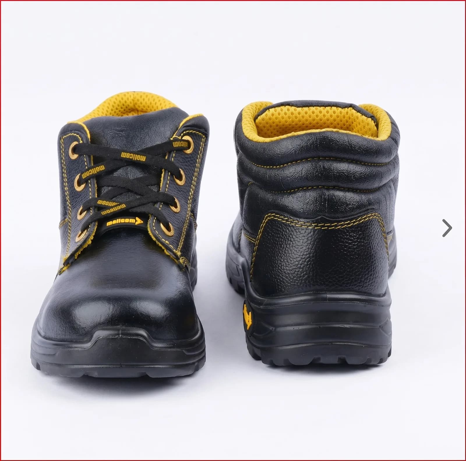 Bottine de sécurité Mallcom en cuir noir à doublure jaune, vues de face et de dos